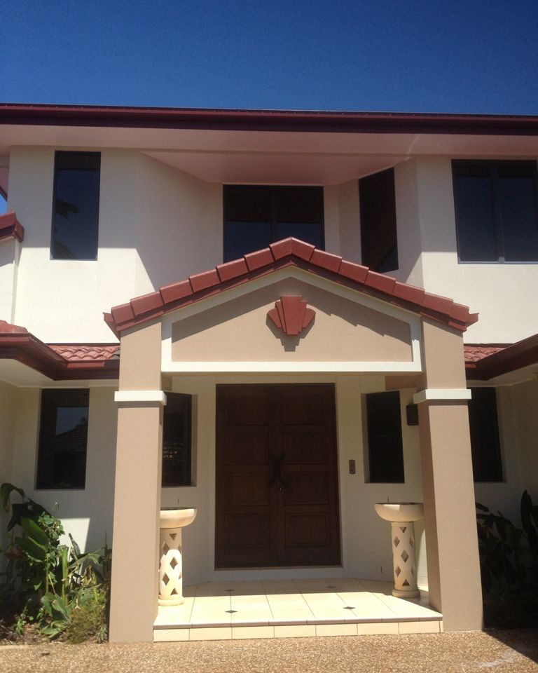 Two-storey home with a freshly painted front entry