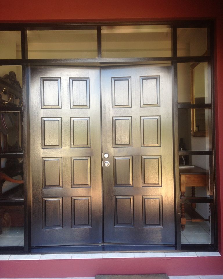 Double timber front doors refinished in a dark stain