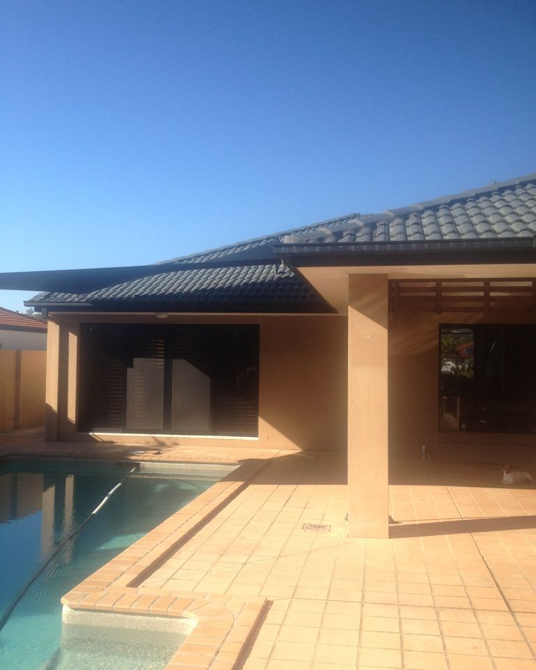 Poolside exterior repainted in a warm neutral